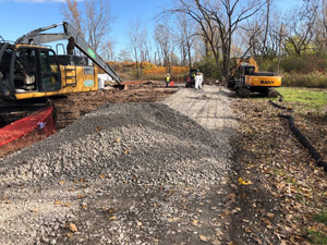October 2019 - Site 108 - view looking northeast. Reconstruction of tank access ramp in preparation for loading of stabilized tar onto transport trucks. 